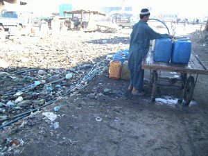 Boy filling drinking water to sell